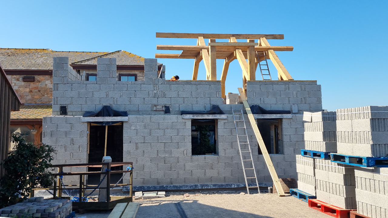 Oak trusses being fitted together on site from flat pack supply